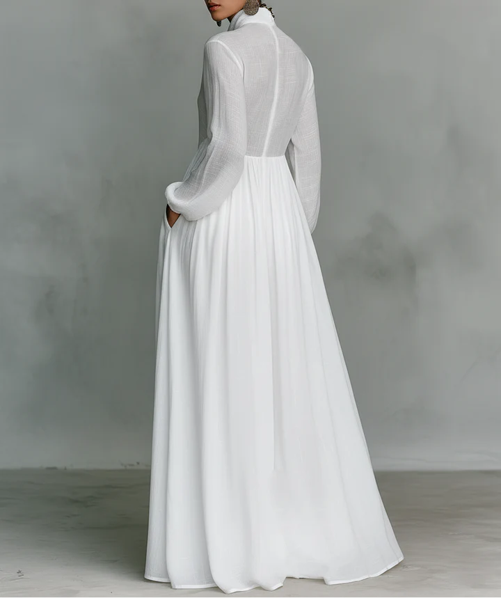 Maxi minimalista de algodón y lino con patchwork, cuello alto y mangas largas