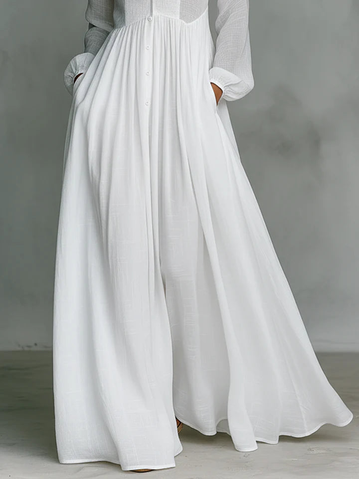 Maxi minimalista de algodón y lino con patchwork, cuello alto y mangas largas